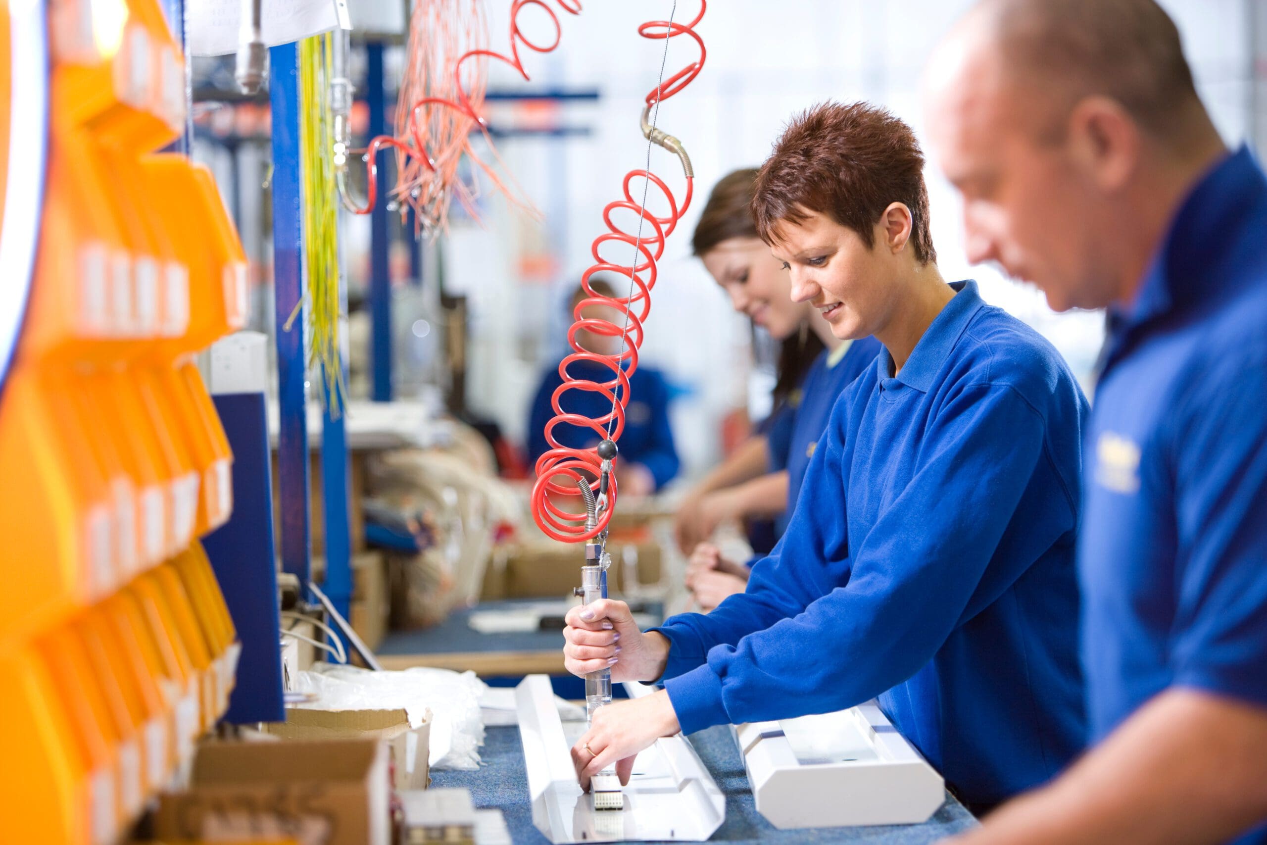 people working in a factory setting