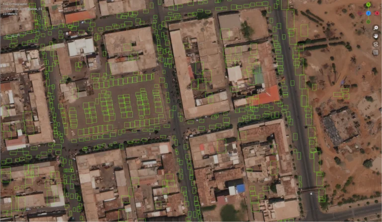 A satellite RGB scene where an AI inpainting tool has automatically removed all of the automotive vehicles from the scene.
